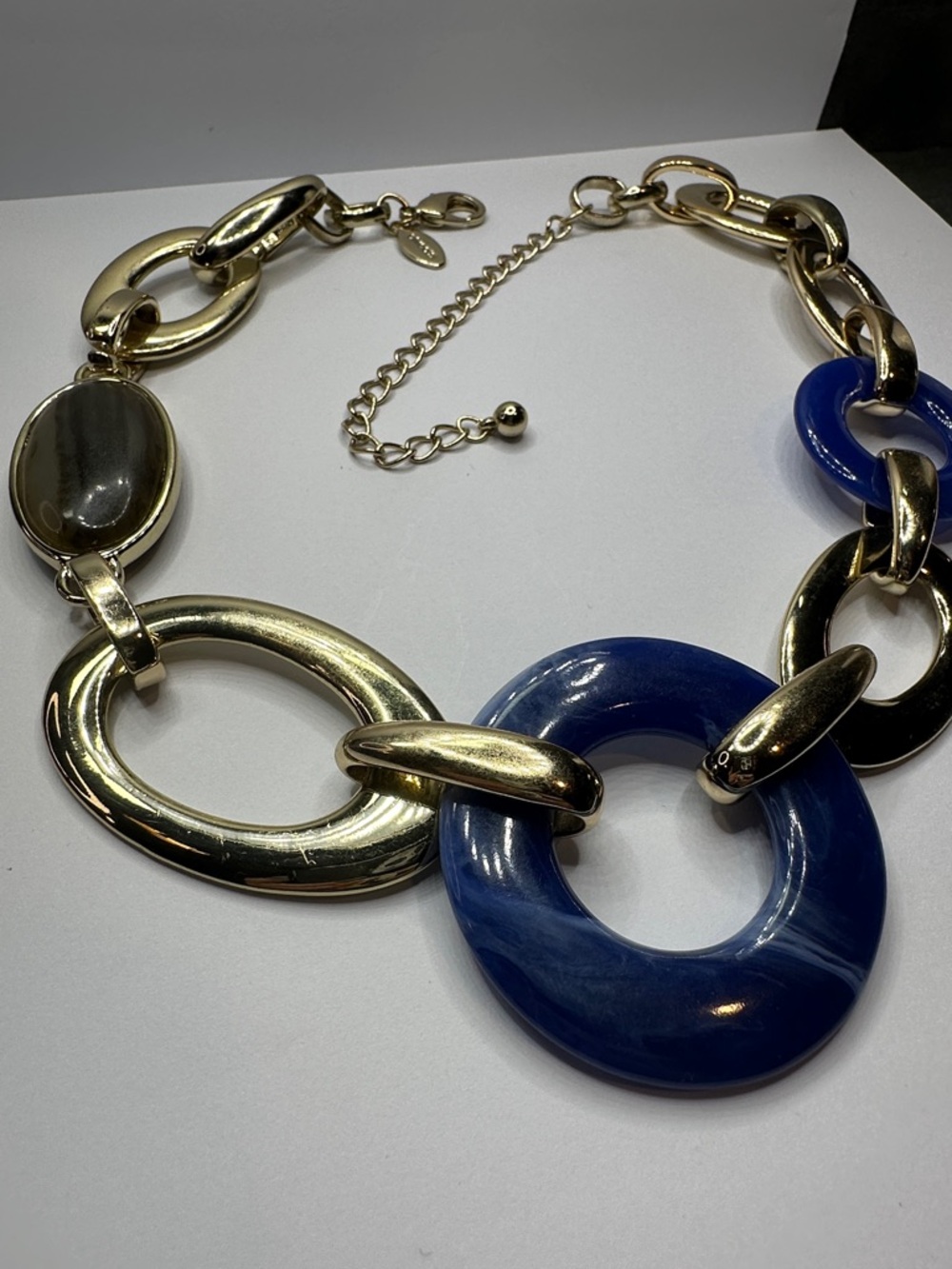 Chico's Gold-Tone Link Necklace with Deep Blue Swirled Lucite Rings - Picture 3 of 5